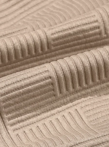 Close-up of khaki jacquard knit fabric with 3D geometric texture for men's hoodie