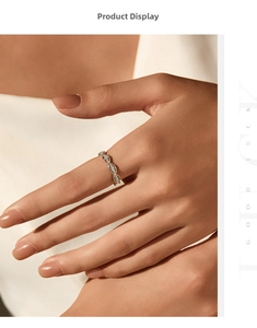 Detailed view of S925 silver braided twist ring with VVS1 moissanite stones