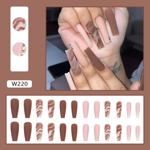 Long ballerina press-on nails set with chocolate brown marble design and sparkling rhinestones