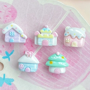 Detailed macro view of five colorful miniature resin castle houses for DIY crafts