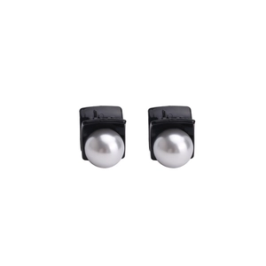 Elegant pair of minimalist round pearl hair claws in classic black and white contrast