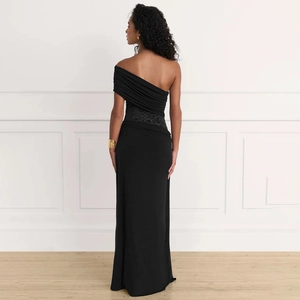 Detailed back view of one-shoulder black dress with pleated shoulder and lace waist