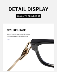 Close-up of flexible metal spring hinges on cat-eye glasses with black and gold frames