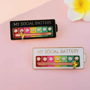 Detail of sliding lightning bolt on enamel social battery pins with mood indicators