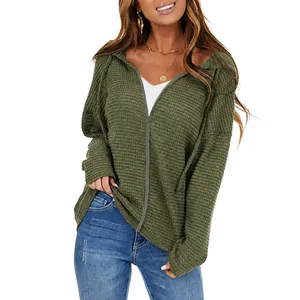 Detail of army green waffle knit texture on women's hooded zip-up casual jacket