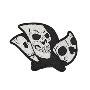 Black and white skull embroidery patch with intricate needlework on white background