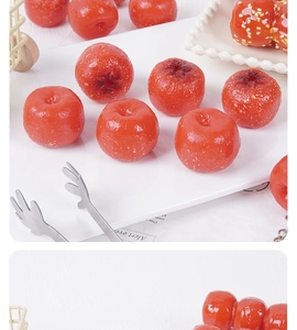 Macro detail of high-gloss PVC artificial hawthorns and realistic mini sugar-coated haws