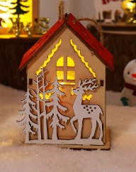 Macro view of a wooden LED glowing Christmas cabin with reindeer and pine tree cutout patterns