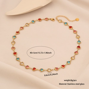 Detail of a gold stainless steel necklace with red and blue glass hearts, length 40+5cm