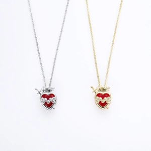 Sacred heart necklace with dagger and flame pendant in gold and silver finish