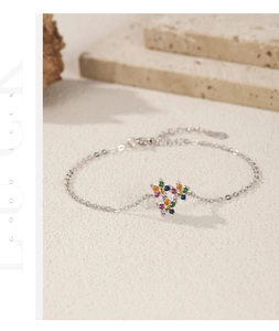 Macro shot of S925 sterling silver bracelet featuring colorful floral gem clusters