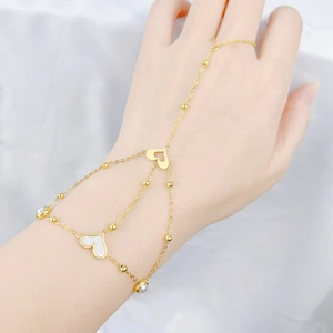 Golden bohemian slave bracelet with shell heart charms and delicate multilayered chains