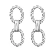 Close-up of silver twist-textured oval link earrings with high-gloss metallic finish