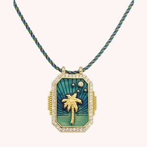 Gold tarot pendant necklace with palm tree motif and colorful braided cord