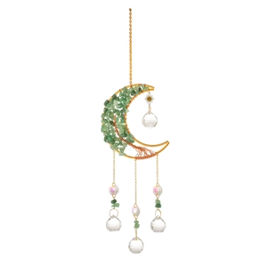 Detailed view of moon-shaped wire suncatcher with green crystal stones and beads