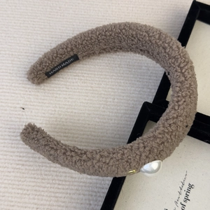 Brown faux shearling headband with handmade label and large pearl decoration