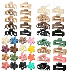 Detail showing various matte claw clips in earth tones and pastel colors for buns