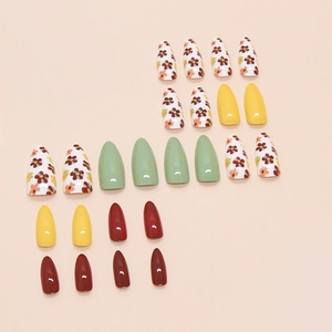 French press-on nails with floral patterns in yellow, green, and burgundy gloss finish