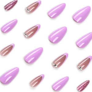 Purple almond press-on nails set with glitter and rhinestone accents on white background