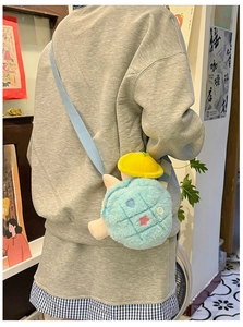 Detailed plush turtle crossbody bag featuring blue checkered pattern and yellow hat decoration