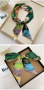 Detailed view of luxury 100% silk skinny scarf with artistic green oil painting print
