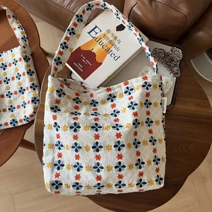 Floral embroidered canvas tote bag with retro flower patterns and vintage rustic aesthetic