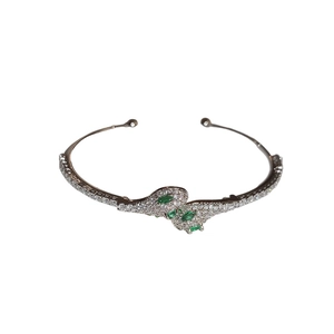 Exaggerated silver snake open bracelet with white zircons and green emerald gems