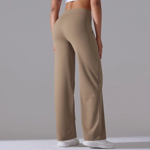 Back view of high-waisted khaki wide-leg yoga pants showing the flowy fit and elastic fabric