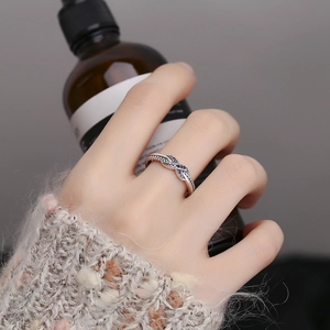 925 silver infinity knot ring with twisted band and purple blue gradient zircons