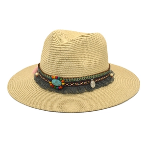 Bohemian Fedora straw hat with turquoise beads and tassel trim on white background