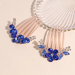 Vintage rose gold floral hair combs set with blue crystals and clear rhinestones