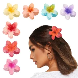 Detailed set of colorful plumeria flower hair clips in soft macaron gradient tones
