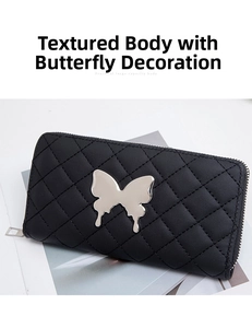 Close-up of black quilted wallet with silver metal butterfly decor and U-shaped zipper