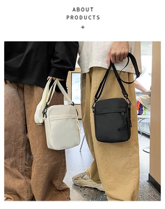 Front pocket detail of waterproof nylon crossbody bags in black and white colors