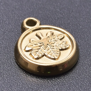 Detailed close-up of golden stainless steel tree charm pendant for DIY jewelry making