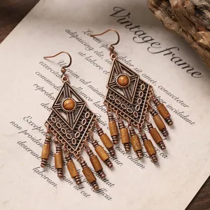 Vintage bohemian drop earrings with wood pendants and antique bronze finish