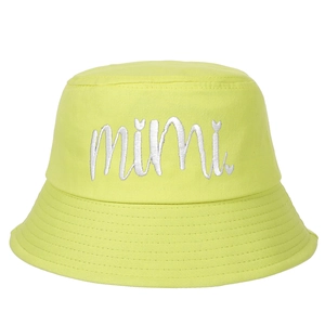 Close-up of silver mimi embroidery with heart detail on neon green canvas bucket hat