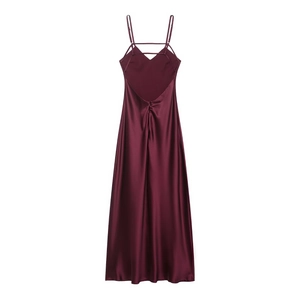 Detail of burgundy satin midi dress showing backless design with crisscross straps