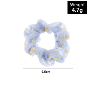 Detail of light blue scrunchie with gold hearts showing 9.5cm diameter and 4.7g weight