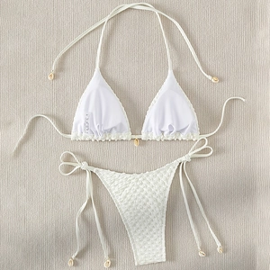 White shell-accented bikini set with textured bubble fabric and side-tie bottoms