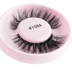 Close-up of style #108A glue-free black false eyelashes in a pink circular storage case