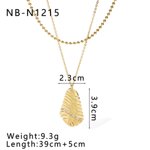 Detailed view of gold leaf pendant with zircon inlay and chain measurement specifications