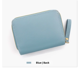 Detail view of the back of a blue PU leather trifold wallet with white stitching and zipper