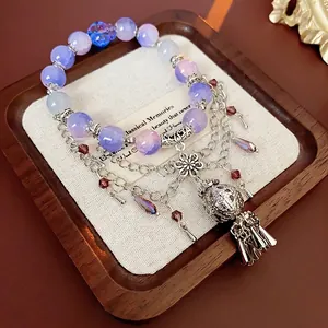 Flower crystal beaded bracelet with silver floral charms and vintage metal tassel