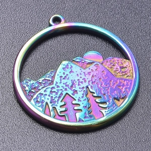 Detailed close-up of a rainbow-colored stainless steel pendant with hollow mountain and sun