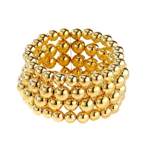 Chunky gold bead chain multi-layer bracelet set in punk geometric style on white background