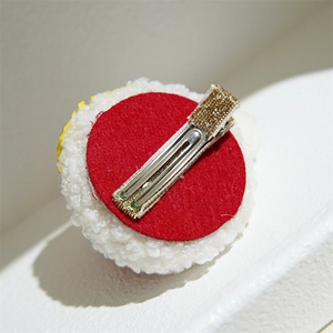 Christmas reindeer hair clip with white fleece base and red felt lining detail