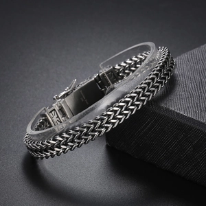 Detail of double-row stainless steel men's bracelet with 316L material engraving