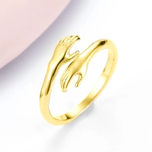 Verstellbarer goldener Umarmungsring mit minimalistischem Hände-Design für Paare
