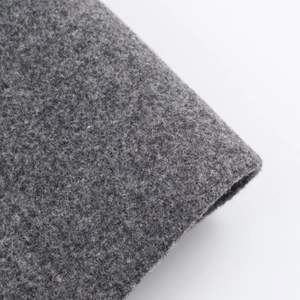 Macro shot of grey wool coat fabric texture and thick woven fiber detail for autumn coat